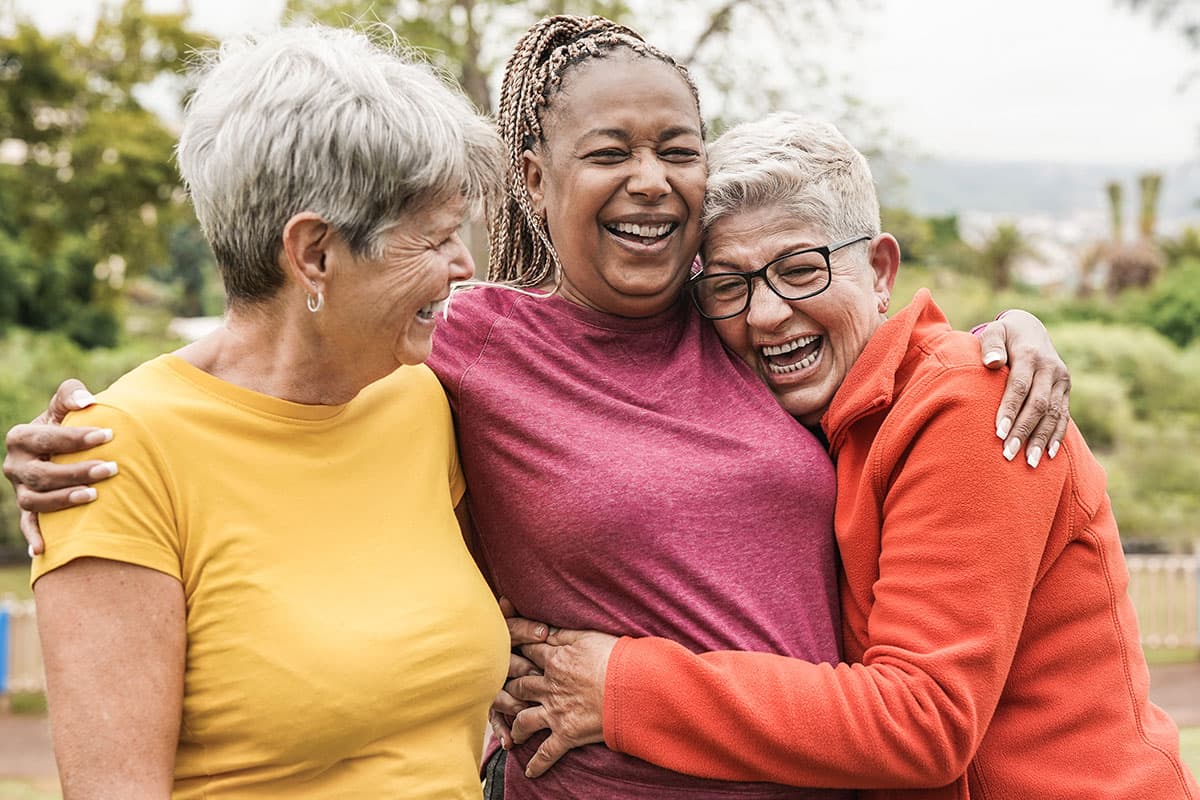 three women hugging after colon cancer surgery in Marion and Mount Vernon